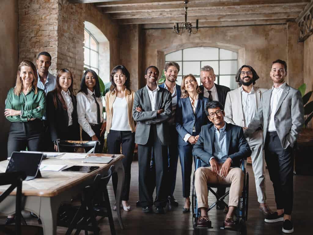 Phone of large diverse team in office. Diversity Recruiting Diverse executives Diversity Equity and Inclusion DEI BIPOC
